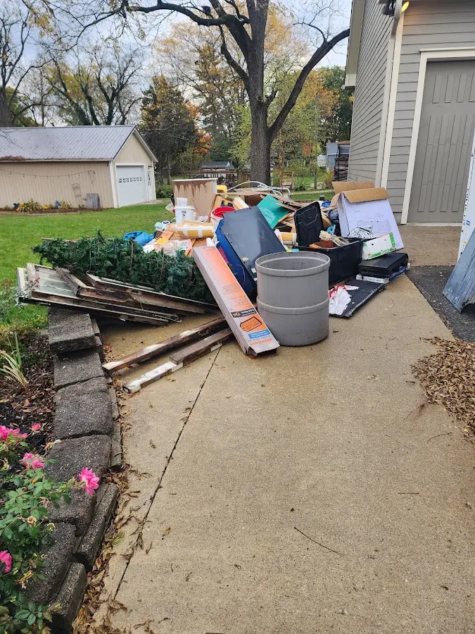 Dumpster being loaded with debris for 3 Yard Dumpster Rental in Havelock